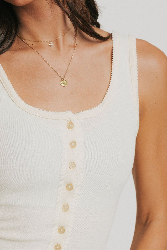 light yellow tank with buttons and picot trim