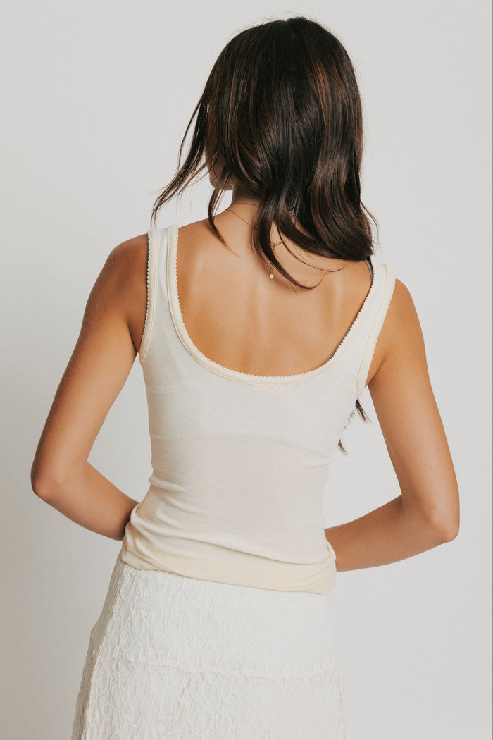 light yellow tank with buttons and picot trim