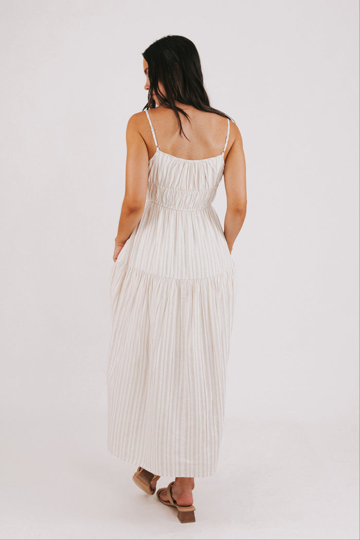 tan striped maxi dress with bow at the waist back full