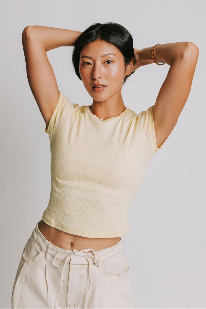 free people light yellow baby tee with pointelle detail front