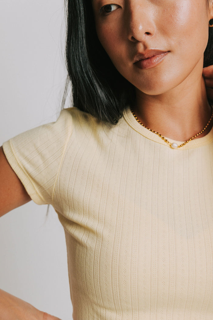 free people light yellow baby tee with pointelle detail close