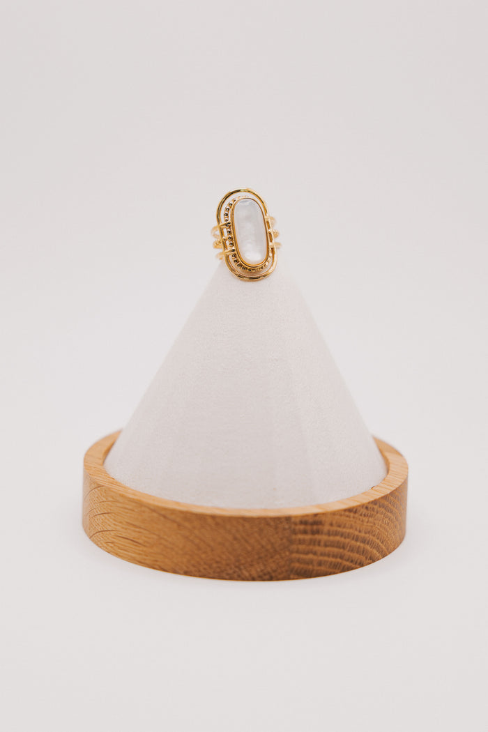 gold geometric ring with white stone