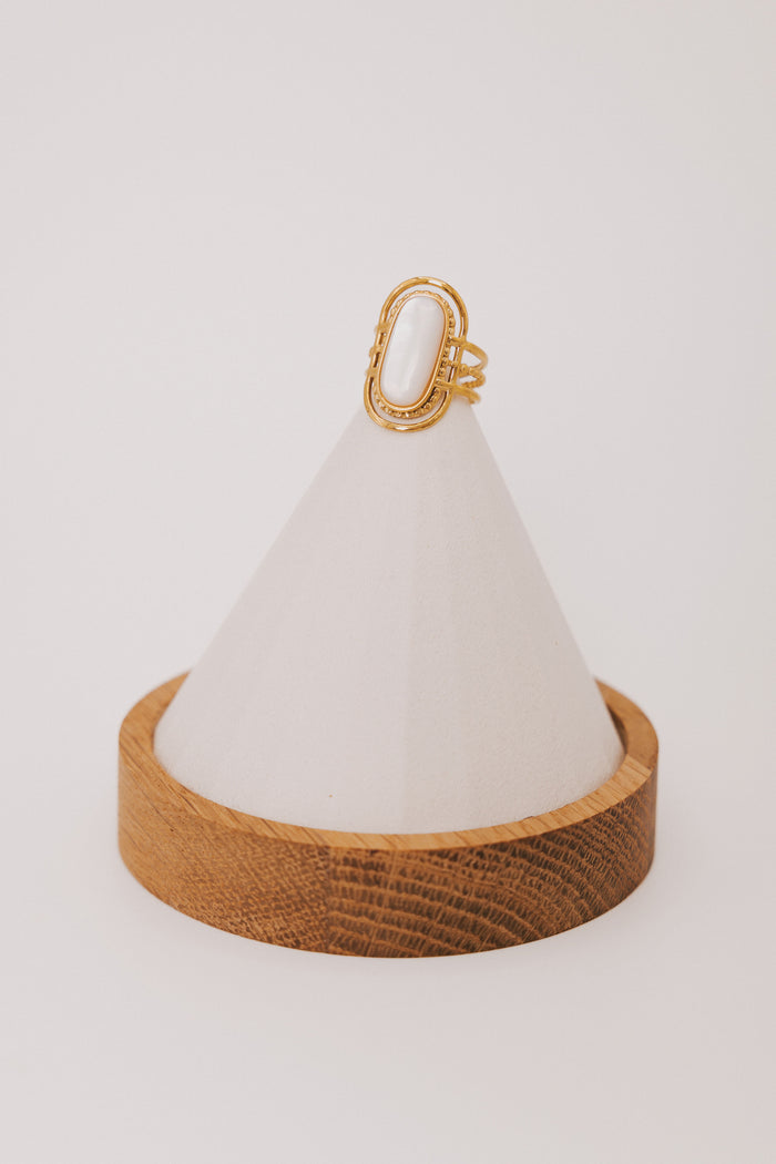 gold geometric ring with white stone