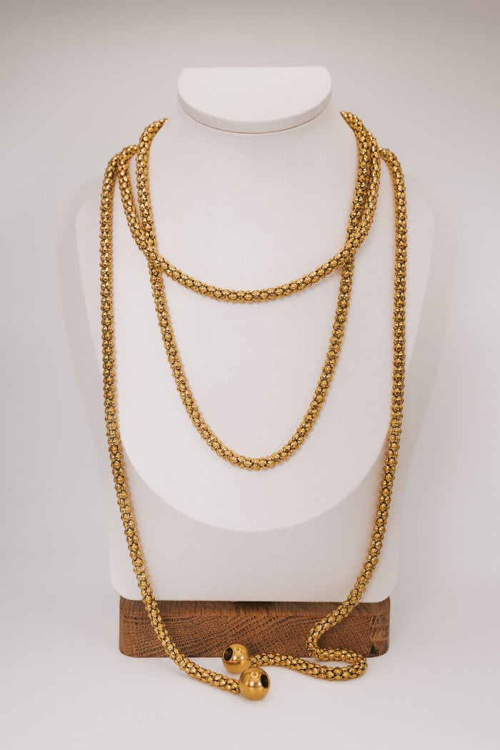 golden line necklace display