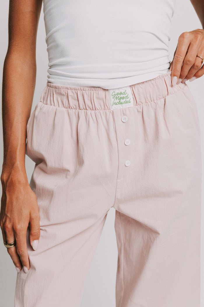 mauve pants with elastic waistband and buttons