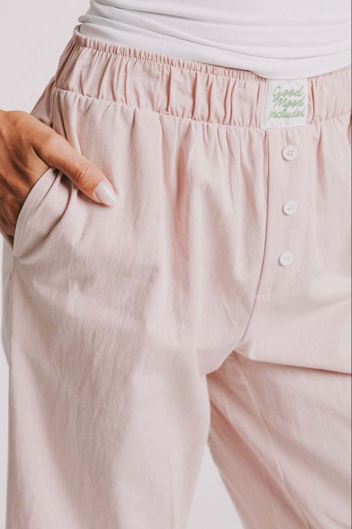 mauve pants with elastic waistband and buttons