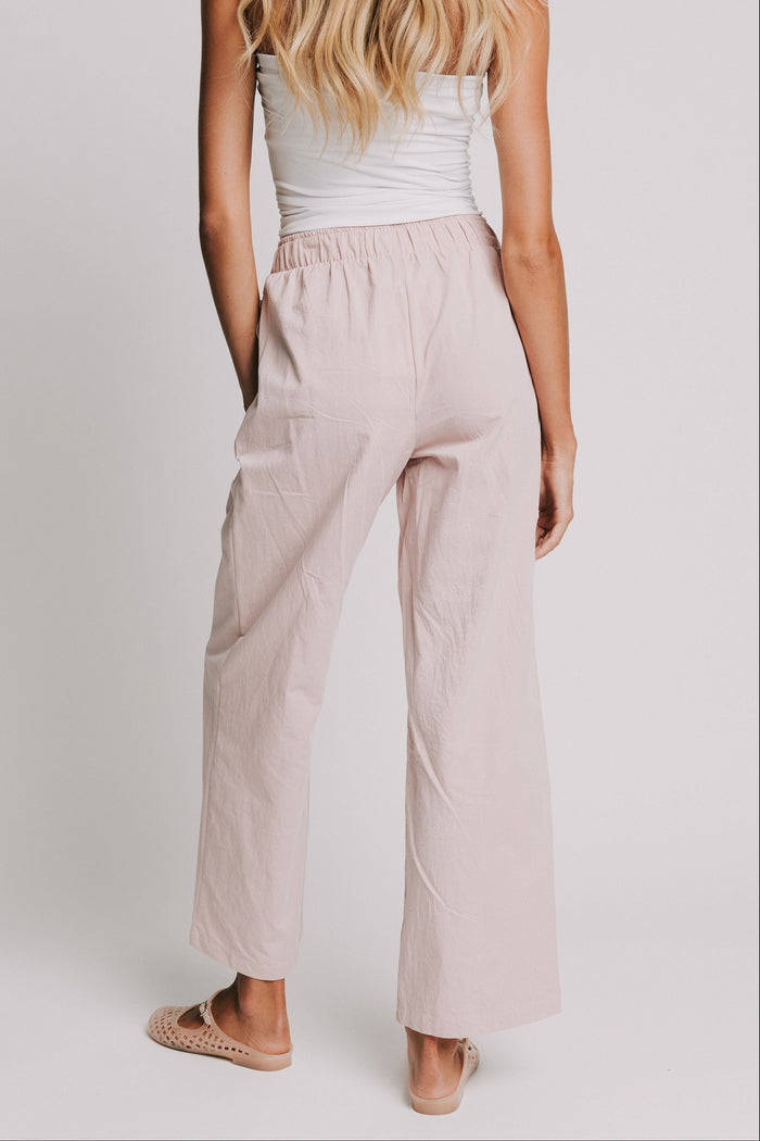 mauve pants with elastic waistband and buttons back