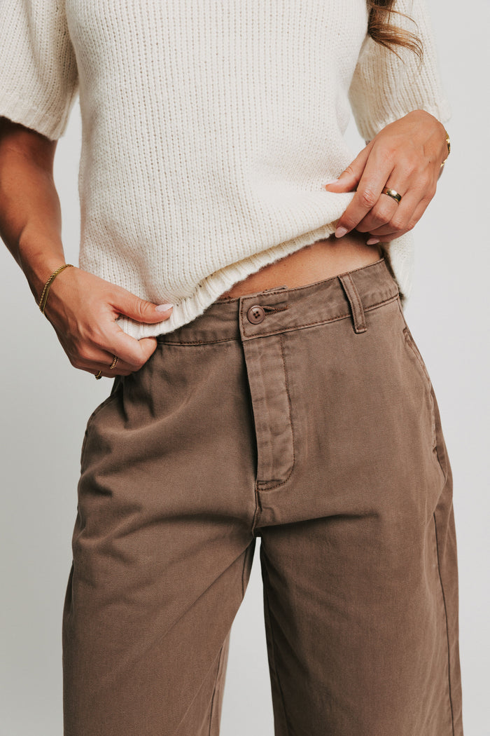 brown button fly barrel jeans close
