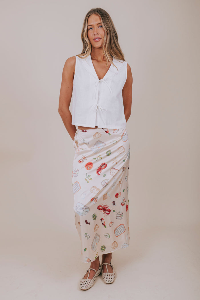 white sleeveless vest with bows full