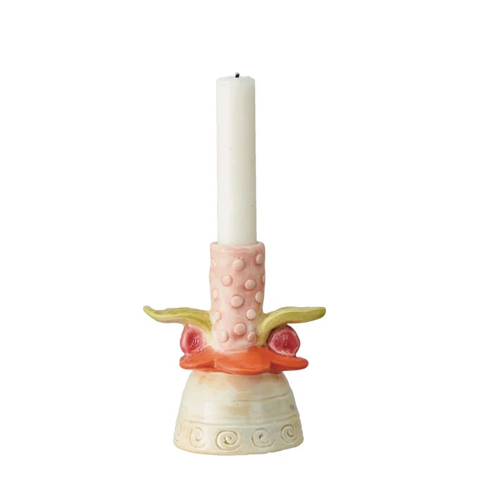 Decorative taper candle holder resembling a tropical flower with a pink top and green and orange accents