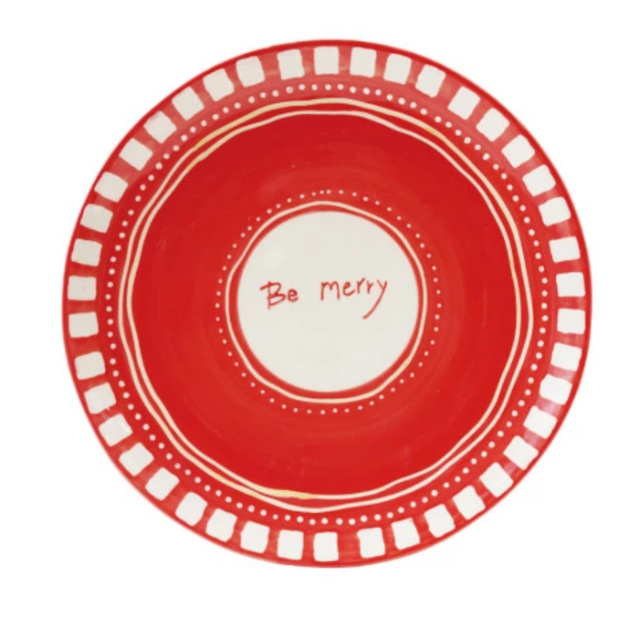 Red plate with white text 'Be Merry' on a white background