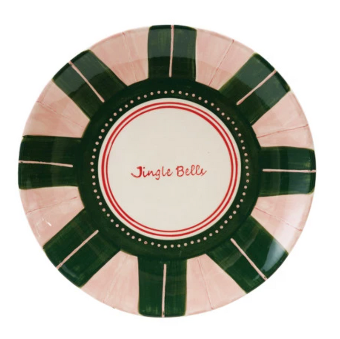 Decorative plate with green and pink stripes and 'Jingle Bells' text on a white background
