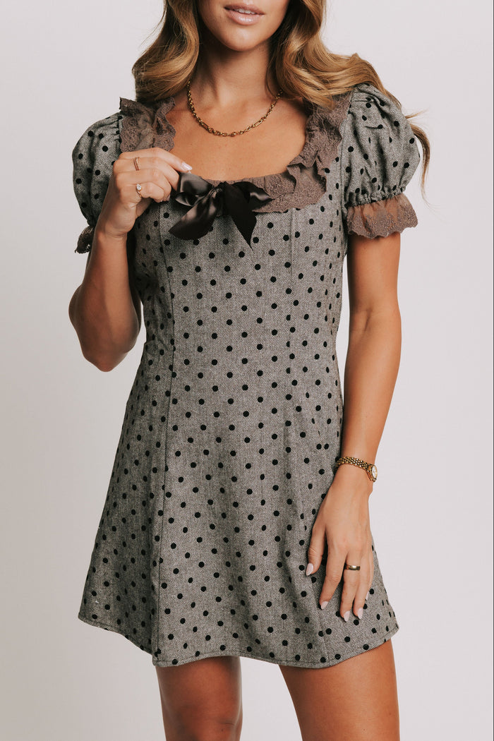 brown and black polka dot mini dress with brown lace trim front