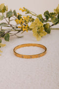 gold bracelet with diamond clovers