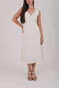 Midi dress that comes in 2 colors, off white and light blue. Sleeveless design with lace trim and side slits.