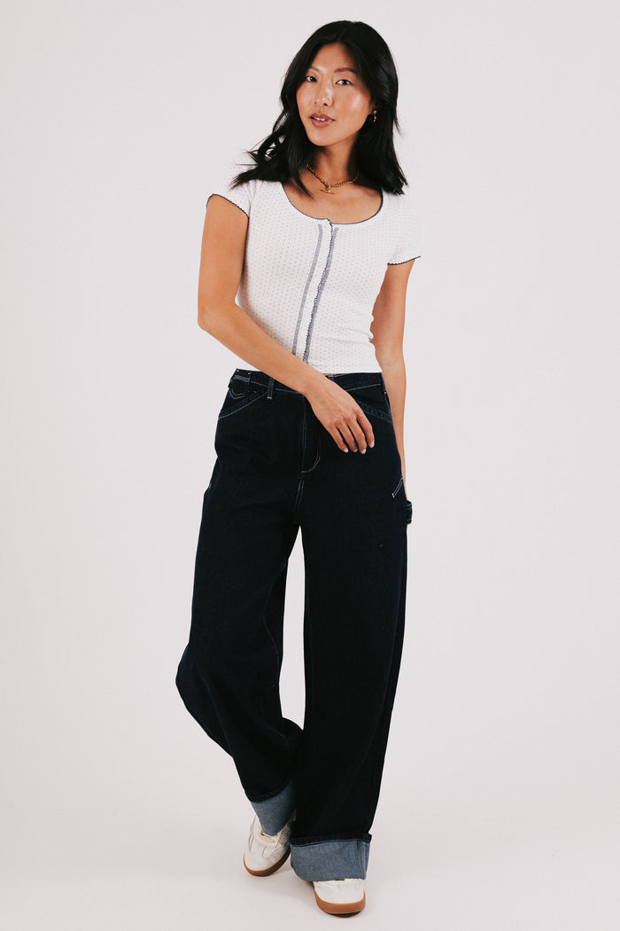 white top with navy polka dots and seams full