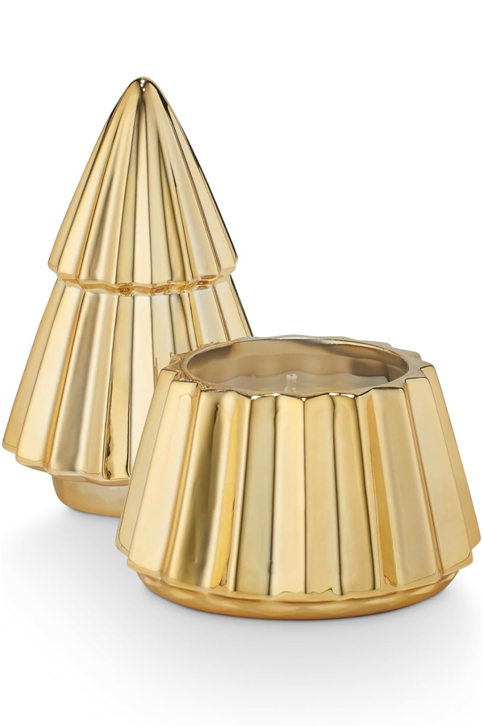 Two piece gold tree-shaped candle on a white background