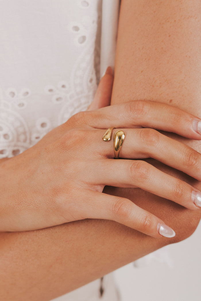 Gold asymmetrical ring with tear drop end double layered