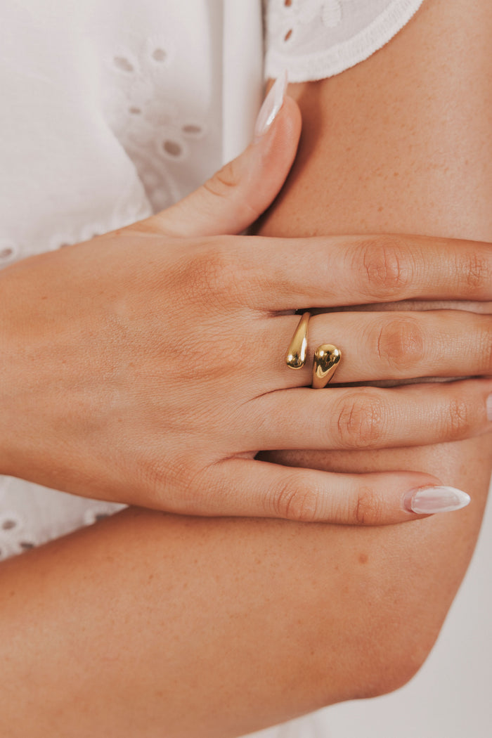 Gold asymmetrical ring with tear drop end double layered