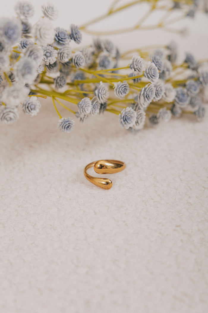 Gold asymmetrical ring with tear drop end double layered