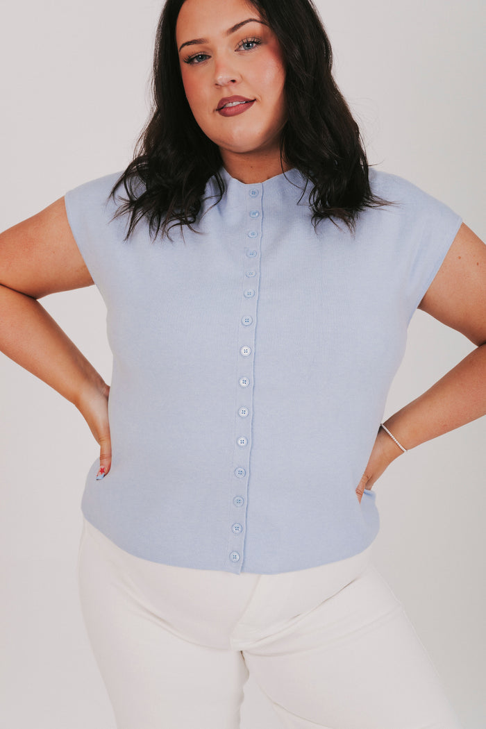 blue top with cap sleeves and buttons down the front