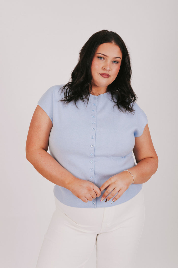 blue top with cap sleeves and buttons down the front