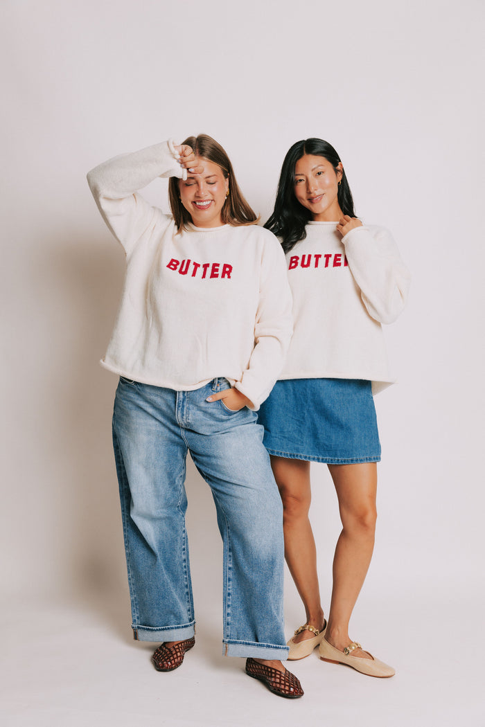 cream sweater with rolled edges with butter emblem models full