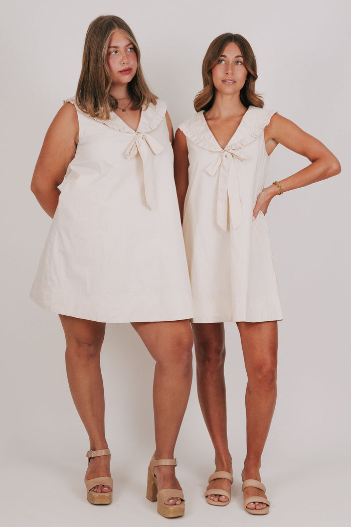 sleeveless mini dress with collar and bow cream
