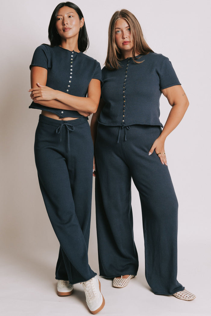 navy wide leg knit pants with rolled edges models