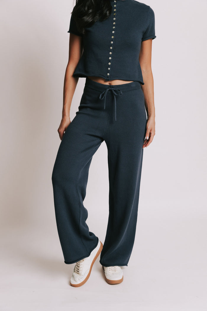 navy wide leg knit pants with rolled edges