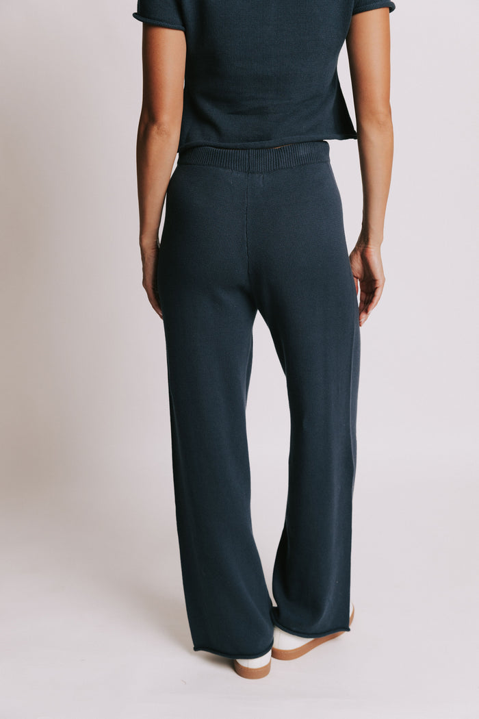 navy wide leg knit pants with rolled edges back