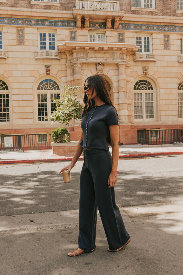 navy wide leg knit pants with rolled edges lifestyle