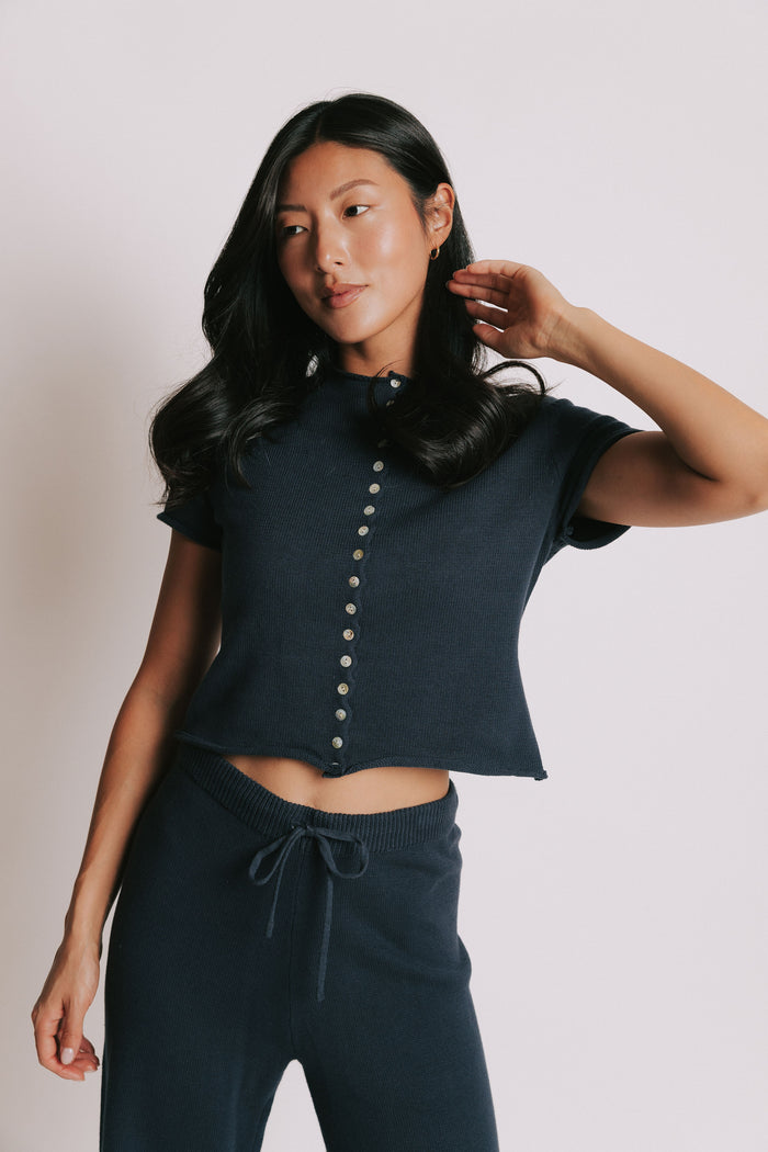 navy short sleeve button down top with rolled edges