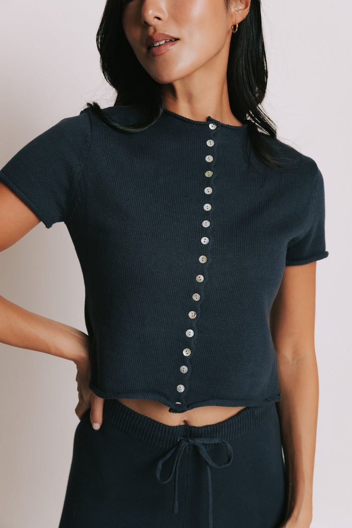 navy short sleeve button down top with rolled edges front