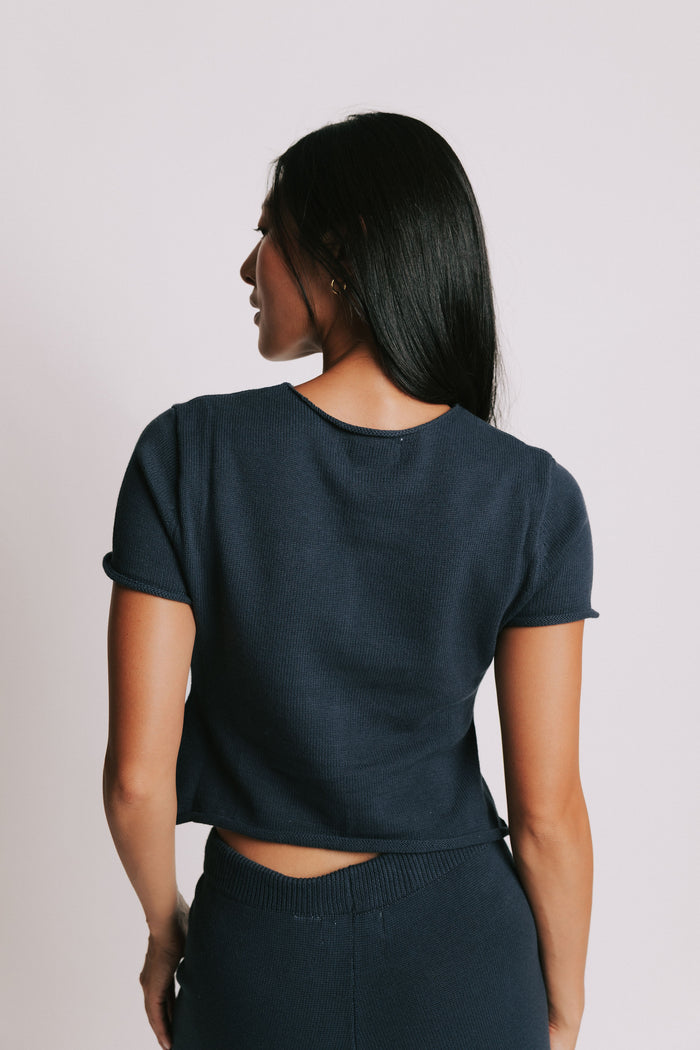 navy short sleeve button down top with rolled edges back