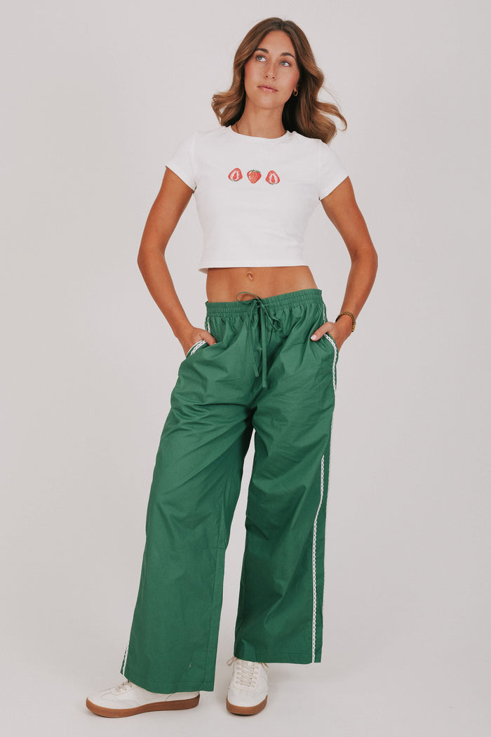 green track pants with lace edges full