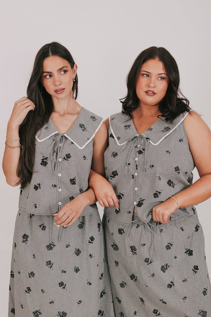 gingham sleeveless top with sheer black flowers and buttons down the front