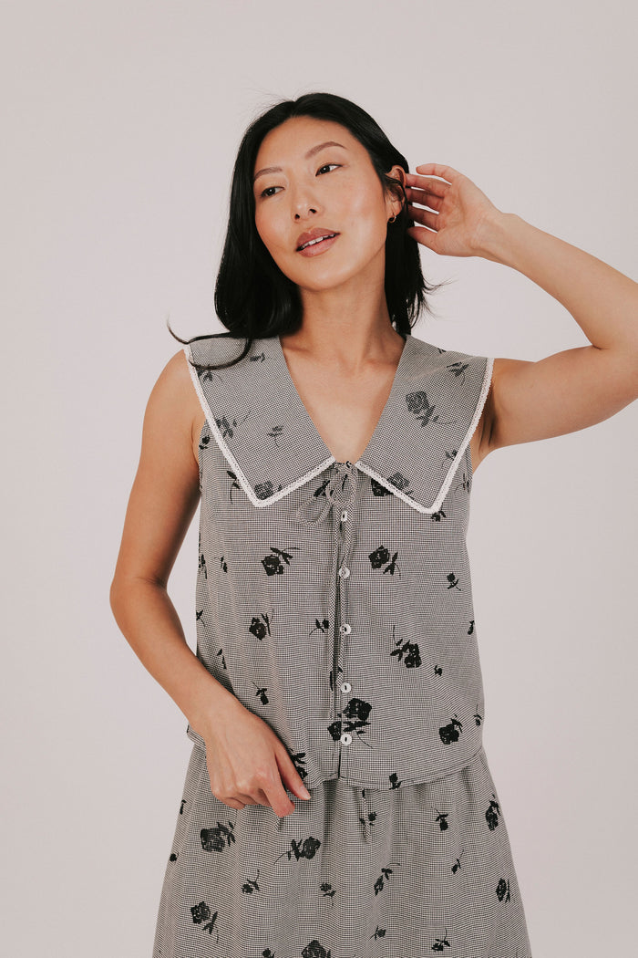 gingham sleeveless top with sheer black flowers and buttons down the front