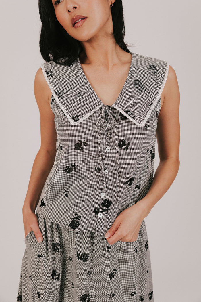 gingham sleeveless top with sheer black flowers and buttons down the front