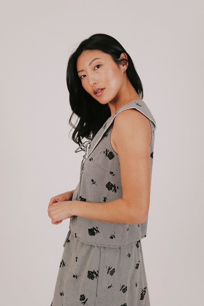 gingham sleeveless top with sheer black flowers and buttons down the front