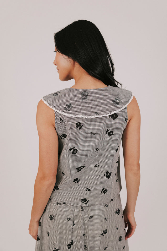 gingham sleeveless top with sheer black flowers and buttons down the front