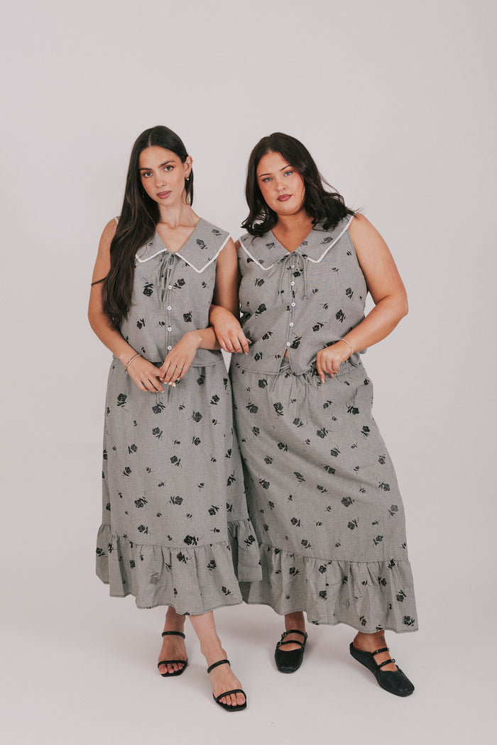 gingham sleeveless top with sheer black flowers and buttons down the front