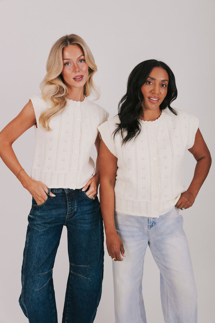 Cream button down knit blouse with scalloped edges and pointelle details