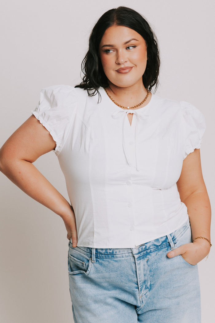 white top with puff sleeves and bow keyhole plus