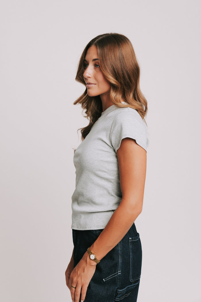 grey ribbed short sleeve top with raw seams side