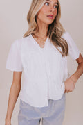 white v neck ruffled tied top detail