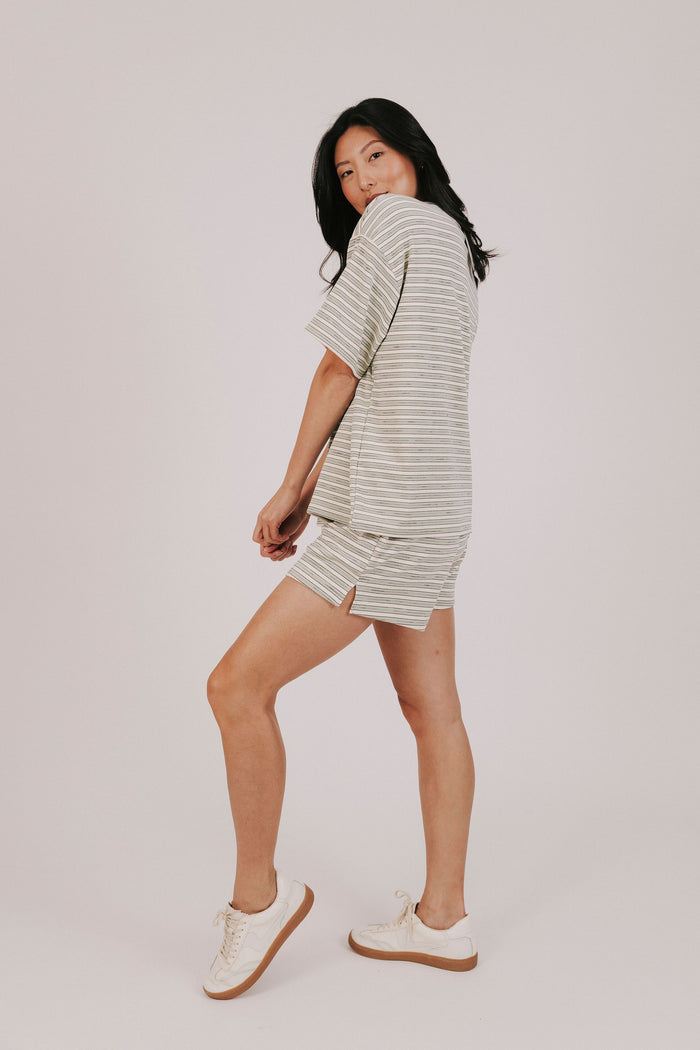 sage striped fleece shorts with pockets and an elastic waistband