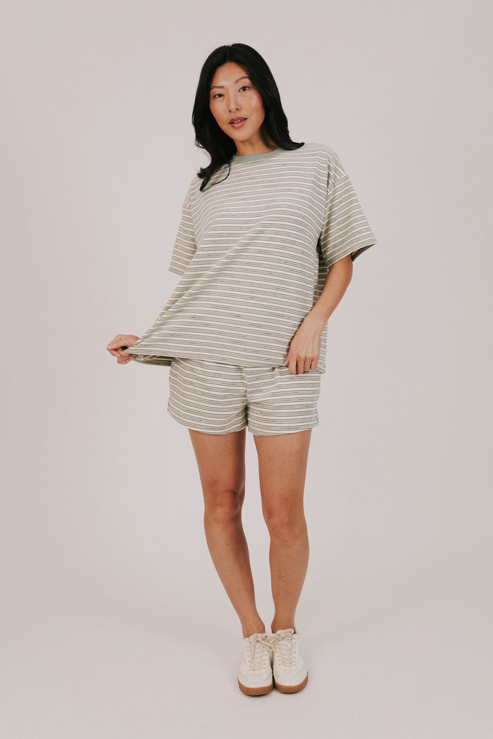 sage striped fleece shorts with pockets and an elastic waistband