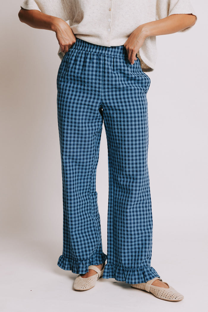 blue gingham pants with ruffled trim and elastic waist front