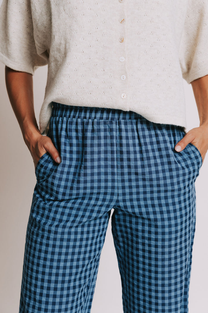 blue gingham pants with ruffled trim and elastic waist close